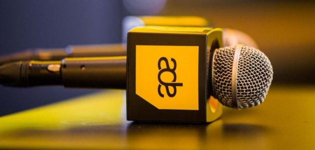 Microphones with Amsterdam Dance Event logo on a table